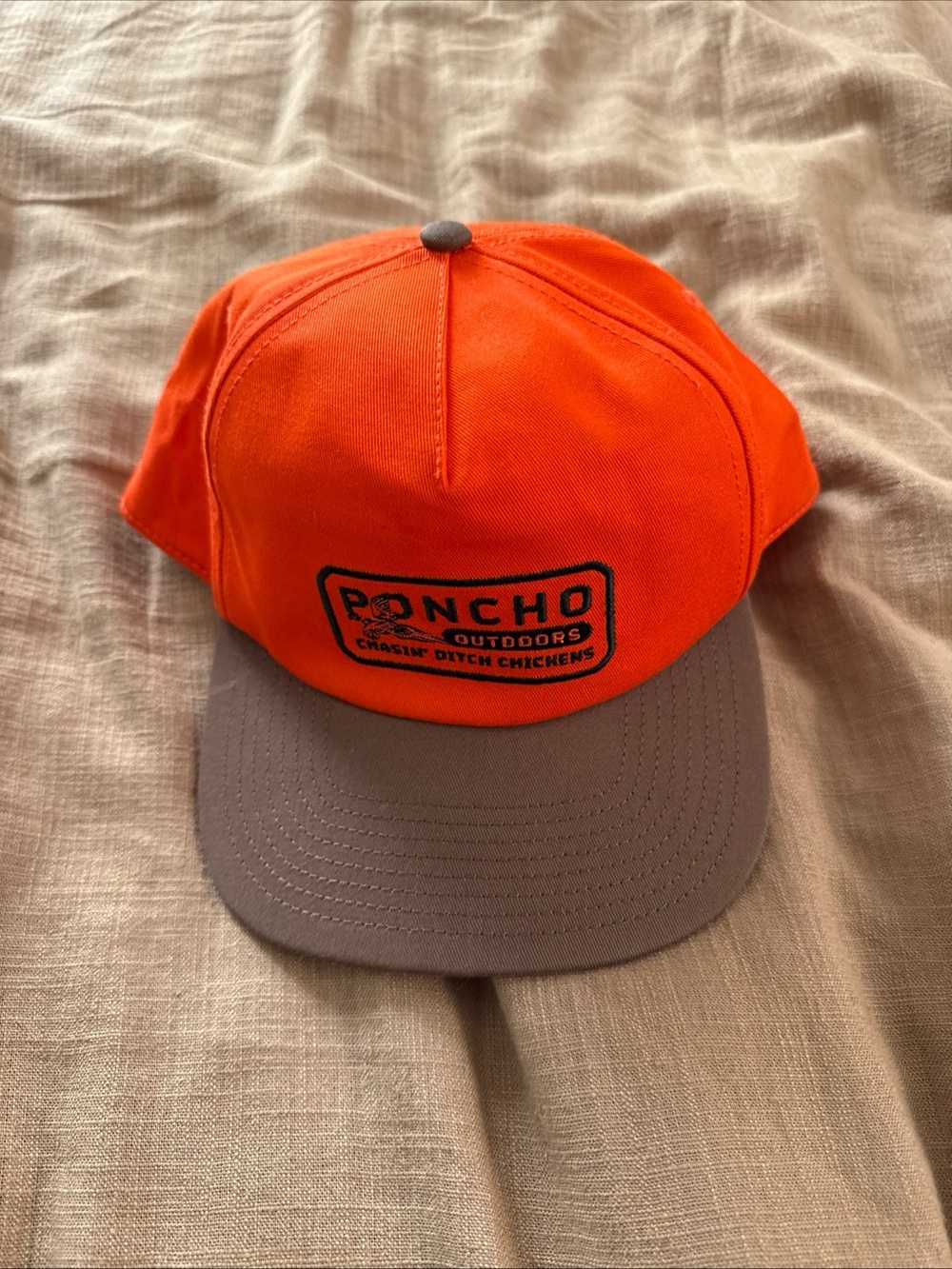 Poncho Outdoors Men's High-Visibility Orange Cap with Brown Brim